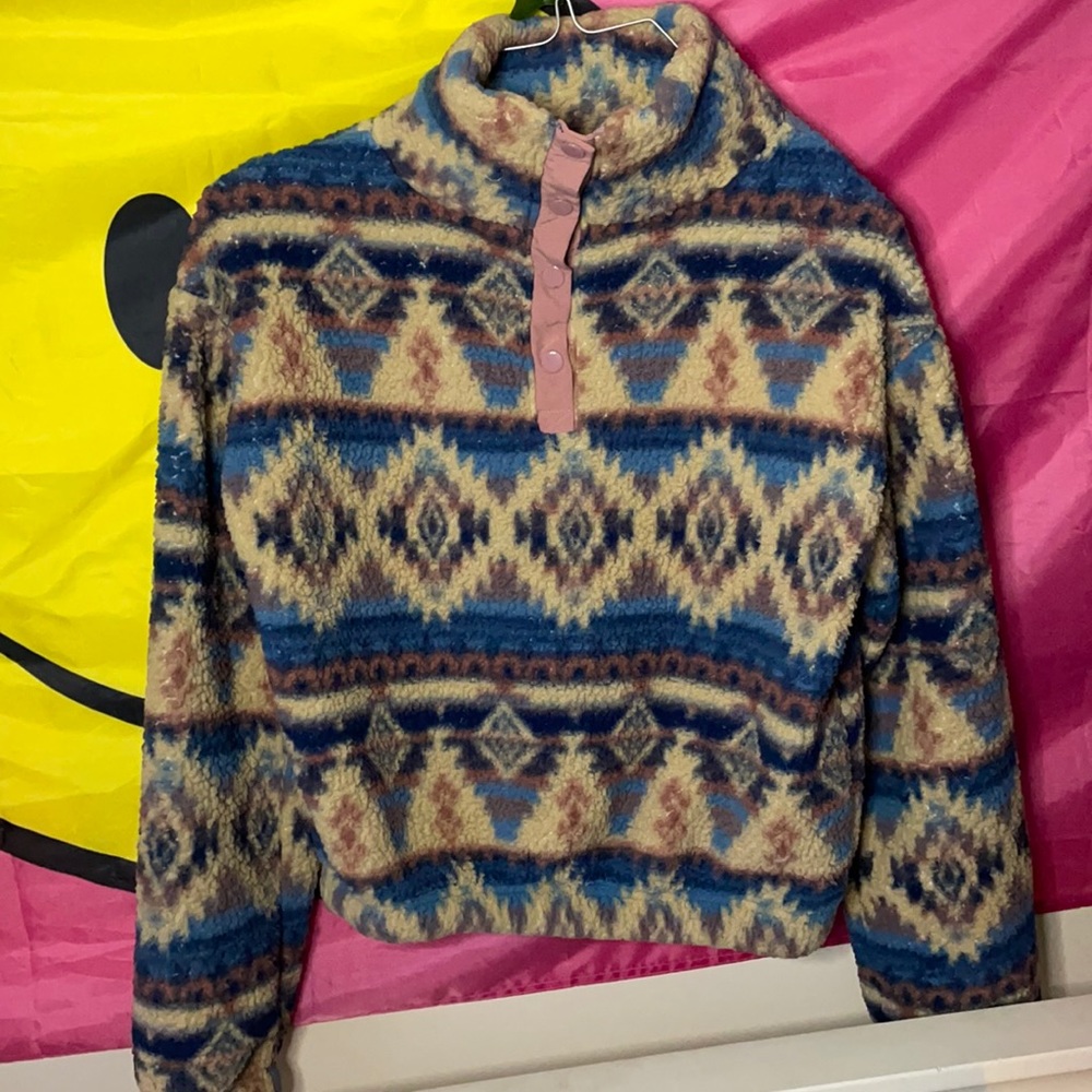 A pull over sweater.                           Women’s Xs